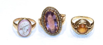 Lot 298 - A cameo ring, unmarked, finger size K; a 9 carat gold amethyst and seed pearl ring, out of...