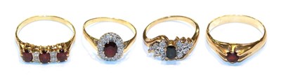 Lot 306 - A 9 carat gold garnet solitaire ring, finger size X1/2; a garnet and diamond cluster ring,...