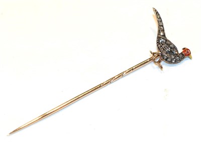 Lot 309 - A stick pin, modelled as a pheasant with a red and yellow enamelled head with a cabochon ruby...