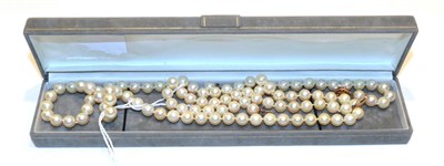 Lot 314 - A cultured pearl necklace with a 9 carat gold clasp, length 51cm and a pair of cultured pearl...