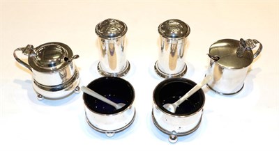 Lot 339 - A five-piece silver condiment-set, marked for London and Chester, comprising: a mustard-pot; a pair