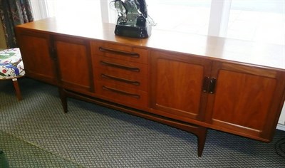 Lot 1563 - A 1960's/70's G-Plan Teak Sideboard, the centre section fitted with four drawers enclosed each side