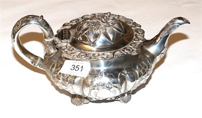 Lot 351 - A George IV silver teapot, possibly by William Hewitt, London, 1830, lobed compressed circular, the