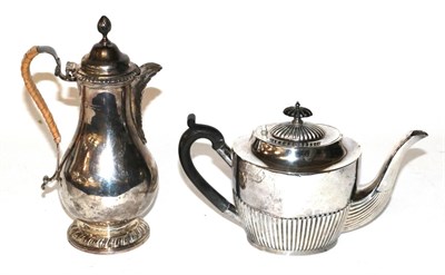 Lot 355 - A Victorian silver teapot and a Victorian silver hot-water jug, the teapot by Mappin and Webb,...