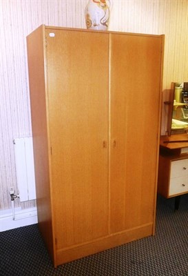 Lot 1564 - An E Gomme of High Wycombe G-Plan Oak Veneered Bedroom Suite, comprising kneehole dressing...