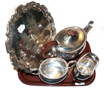 Lot 360 - A three-piece George V silver tea-service and an associated George V silver salver, the service...