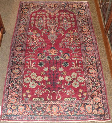 Lot 430 - Khoy prayer rug, the raspberry field with an urn and plants beneath the Mihrab, enclosed by...