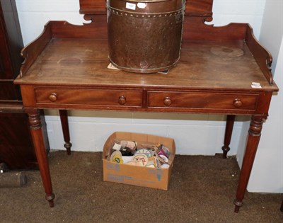 Lot 469 - A 19th century mahogany washstand, with shaped gallery above two drawers, raised on octagonal...