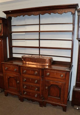 Lot 472 - An early 19th century oak break front dresser and rack, 162cm wide