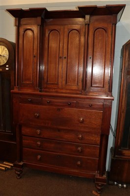 Lot 480 - A 19th century oak inverted break front linen press