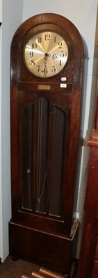 Lot 481 - An Art Deco quarter chiming longcase clock, oak veneered case with arched pediment and an...