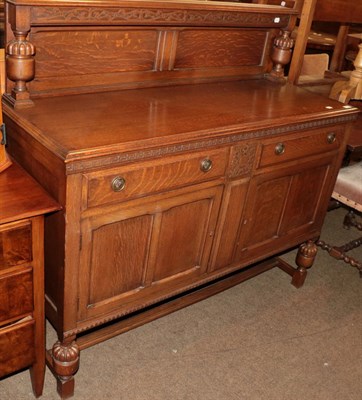 Lot 485 - An early 20th century oak sideboard with Greek key moulded frieze, above two drawers and two...