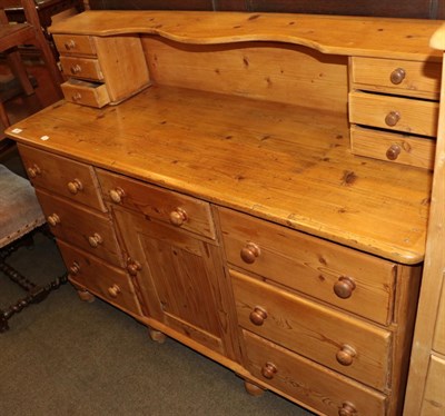 Lot 492 - An early 20th century pine dresser with raised superstructure containing two banks of three...