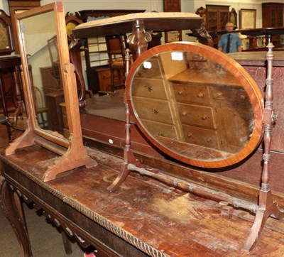 Lot 496 - A 19th century mahogany oval dressing table mirror with turned supports; together with an Edwardian