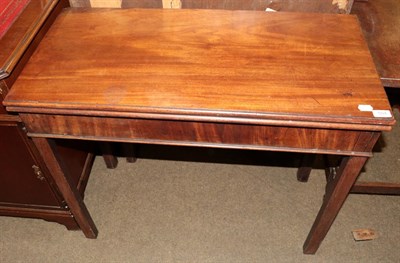 Lot 504 - A 19th century mahogany fold over tea table