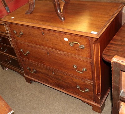 Lot 507 - A George III style mahogany chest of drawers, with canted corners, three graduated drawers,...