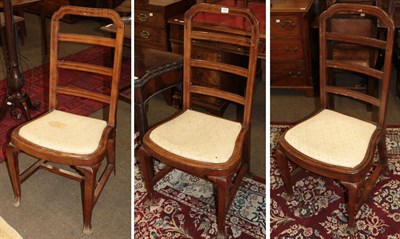 Lot 514 - A set of three late 18th century walnut side chairs, possibly Dutch, strung with boxwood, with...