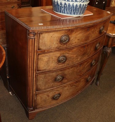 Lot 522 - A Regency mahogany bow fronted chest of drawers, with fluted pilasters and raised on bracket...