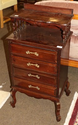 Lot 540 - An early 20th century four drawer chest with spindle turned shelf