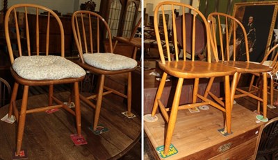 Lot 563 - Four beech spindle back chairs, possibly Ercol