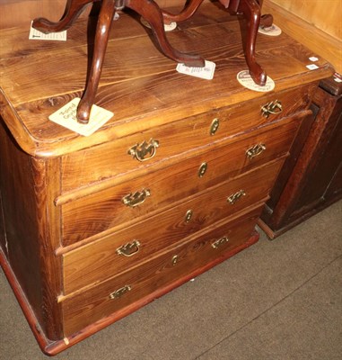 Lot 566 - A pine chest made of reclaimed timber, with rounded corners flanking an arrangement of four...