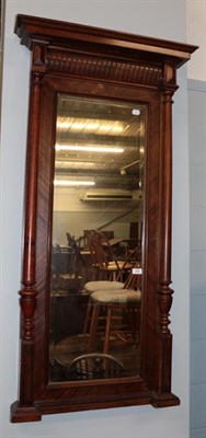 Lot 584 - A mahogany bevelled glass pier mirror with tapering turned pilasters