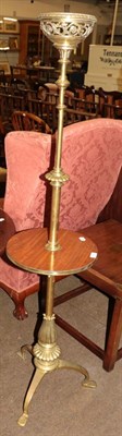 Lot 594 - An early 20th century adjustable brass and mahogany lamp