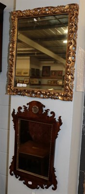 Lot 596 - A Victorian carved gilt wood mirror, 61cm high; and a George III style mahogany and fret cut...