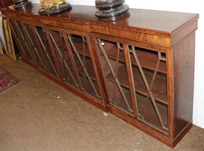 Lot 598 - A 19th century mahogany break front low bookcase, the moulded top above four astragal glazed doors