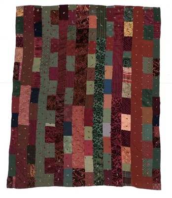 Lot 2000 - A Late 19th/Early 20th Century Tufted Country Thrift Quilt, incorporating examples of...