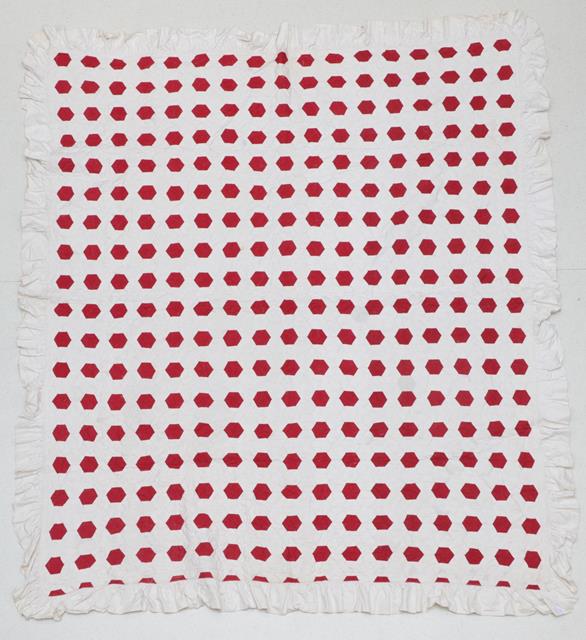 Lot 2001 - A Late 19th Century Turkey Red and White Cotton Hexagonal Quilt, quilted in circular leaf...