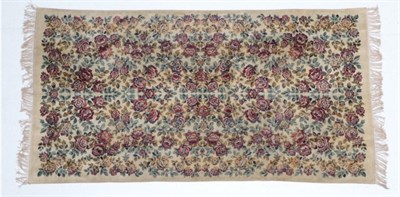 Lot 2015 - A Late Victorian Chenille Table Rug, decorated overall with rust coloured flower heads on a...
