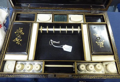 Lot 2038 - A 19th Century Chinese Export Lacquered Work Box, decorated in black and gilt, with brass...
