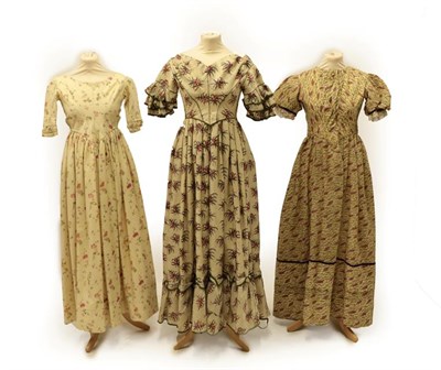 Lot 2042 - A Circa 1840's Wool Dress, printed with large pink floral sprigs, capped sleeves with three...