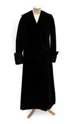 Lot 2048A - An Early 20th Century Black Evening Coat, with collar, fold back buttoned cuffs and two-button...