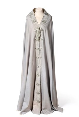 Lot 2049 - An Early 20th Century Liberty Eau de Nil Wool Cape, with a cream silk lining, stylised Art...