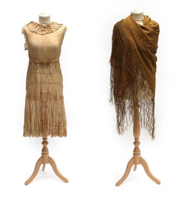 Lot 2061 - A Circa 1920's Drop Waist Lace Dress, in a coffee colour with capped sleeves, gathered trim to...