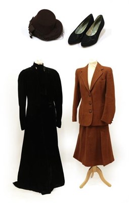 Lot 2066 - A Circa 1920's Black Velvet Evening Coat, full length with long sleeves, collar, single button...