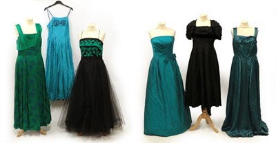 Lot 2087 - Six Circa 1950's Evening Dresses/Gowns, comprising a turquoise silk strapless gown, with hooped...