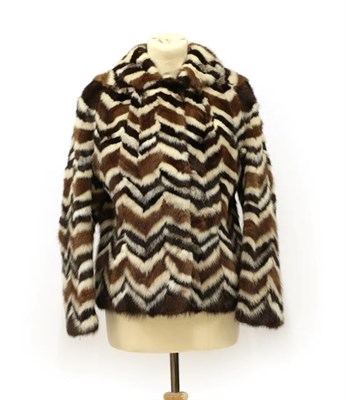 Lot 2093 - A Coloured Mink Chevron Design Short Jacket, in brown, dark brown and white furs