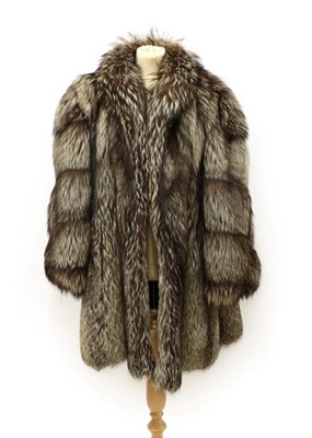 Lot 2097 - A German Silver Fox Fur Coat, with large decorative acrylic button fastening beneath collar