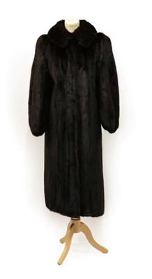 Lot 2099 - A Dark Brown Mink Long Coat, with gathered and bellowed sleeves, lined in purple sateen-type fabric