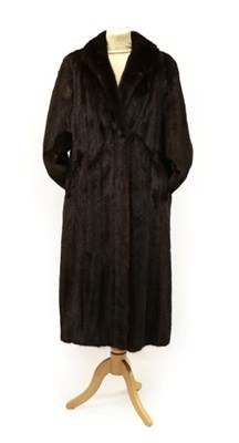Lot 2117 - A Long Dark Brown Mink Coat, the cuffs with leather bow details