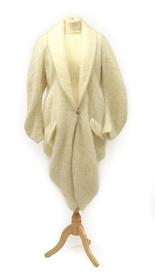 Lot 2123 - A John Galliano Cream Mohair Coat / Cardigan, with single button fastening and gathered draping...