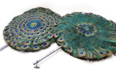 Lot 2131 - A Pair of Early 20th Century Large Decorative Peacock Feather Face Screens, with handles strung...