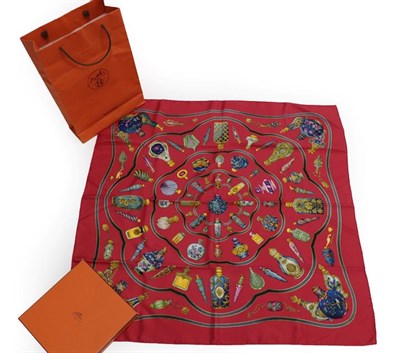 Lot 2183 - A Hermès 'Qu'importe le flacon' Silk Scarf, Designed by Catherine Baschet, printed overall...