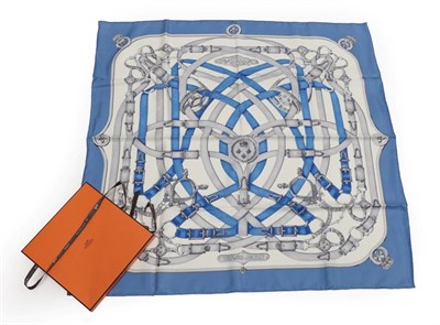 Lot 2186 - A Hermès 'Cavalcadour' Silk Scarf, Designed by Henri d'Orign, printed with various equestrian...
