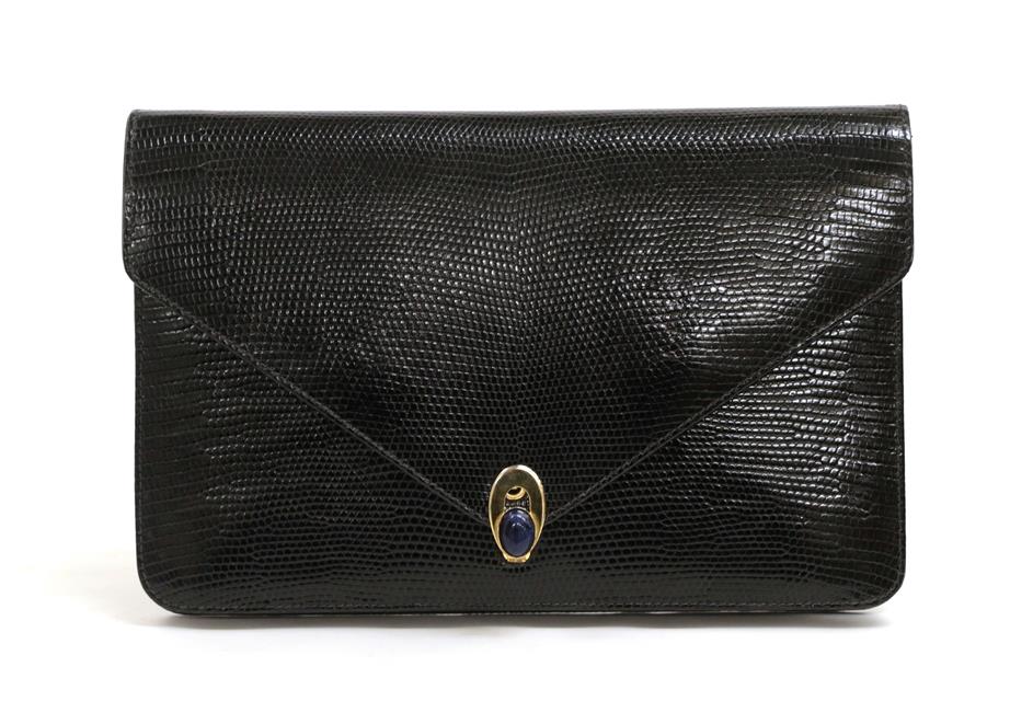 Lot 2217 - A Gucci Black Leather Envelope Clutch Bag, with embossed reptile skin texture, the flap closure...