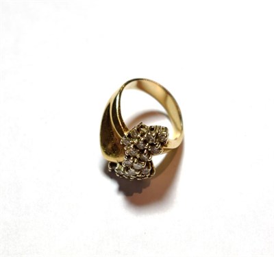 Lot 3 - A diamond cluster ring, asymmetric form, set with twenty round brilliant cut diamonds, total...
