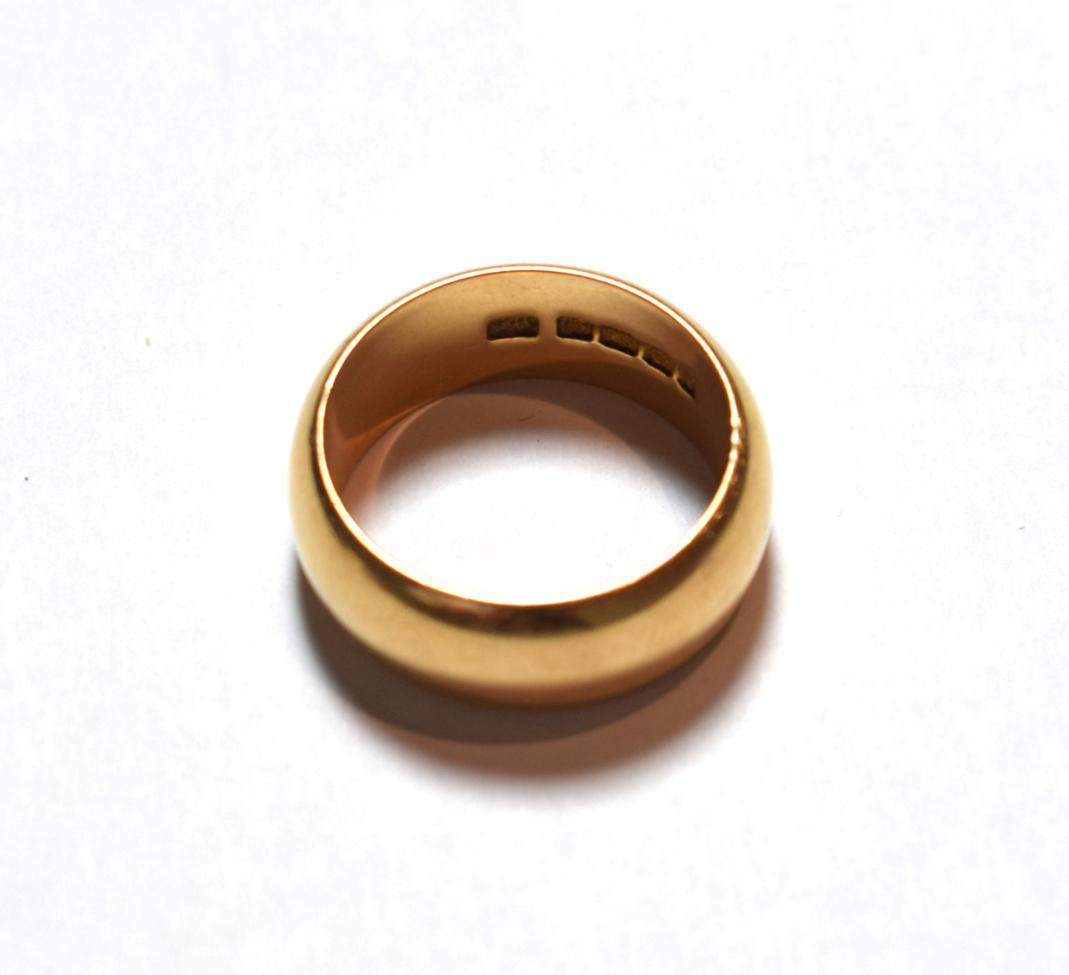 Lot 4 - An 18 carat gold band ring, finger size V